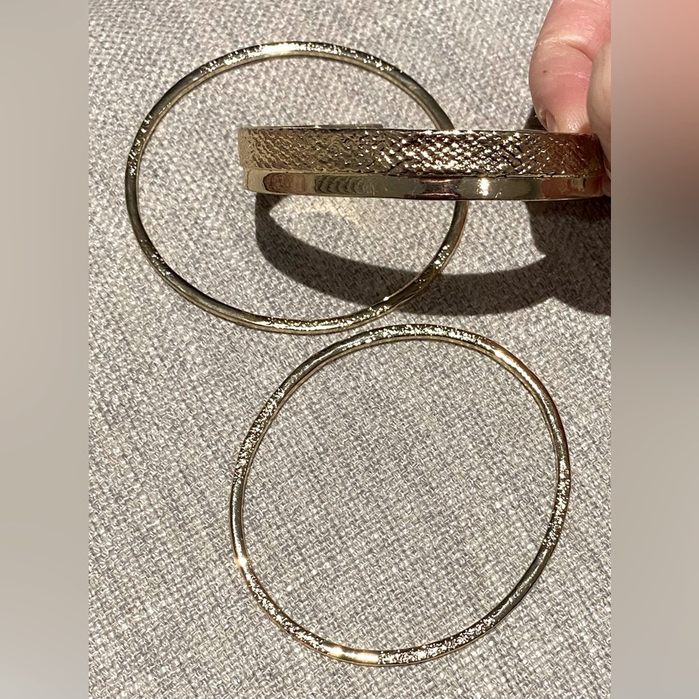 Bundle of 3 gold bracelets.